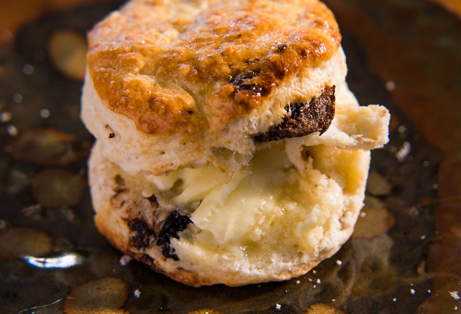 Date Scone dripping in organic salted butter.